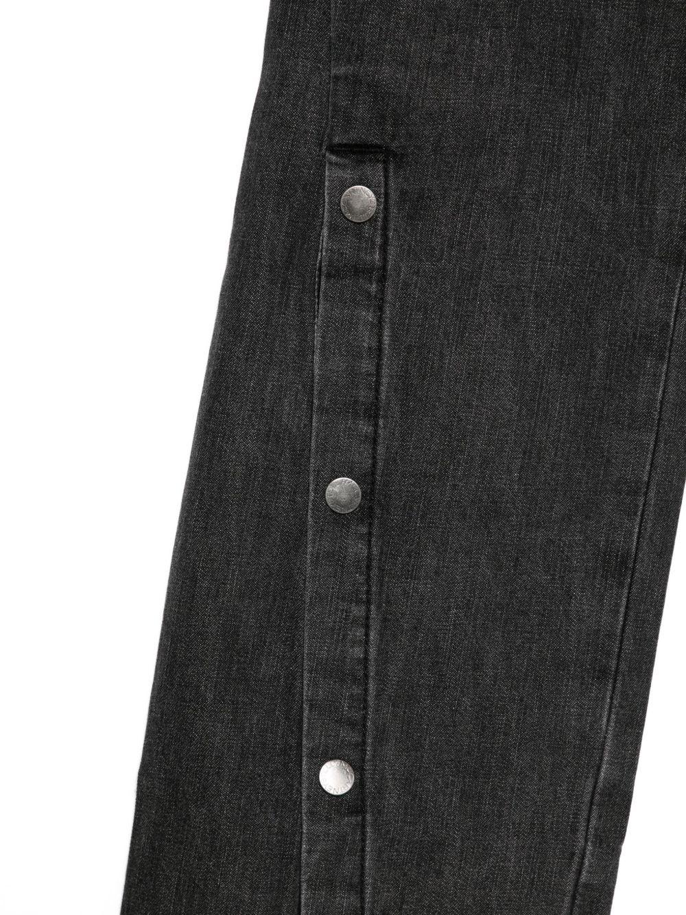 Jeans per bambina Stella McCartney Kids in denim nero con bottoni sulla gamba - Image 2