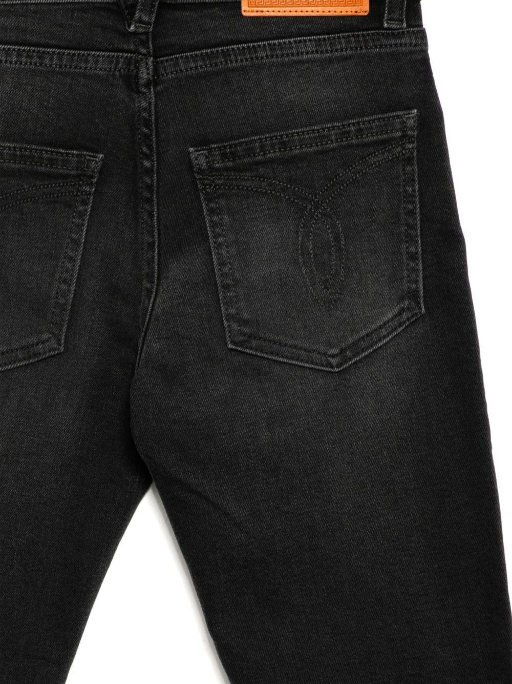 Jeans per bambina Versace Kids in denim nero modello dritto - Image 3