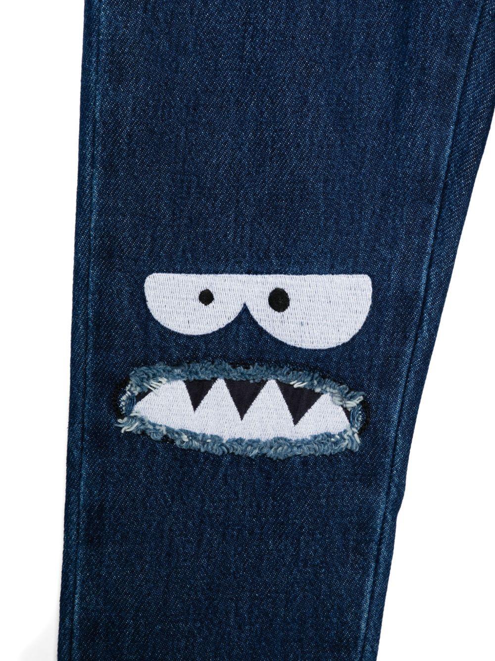 Jeans per bambino Stella McCartney Kids in denim con ricamo sul ginocchio - Image 2