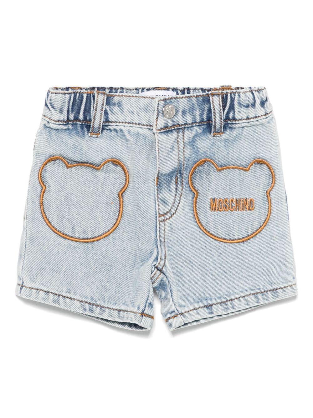 Pantaloncini con logo ricamato per neonata Moschino Kids azzurro con passanti per cintura