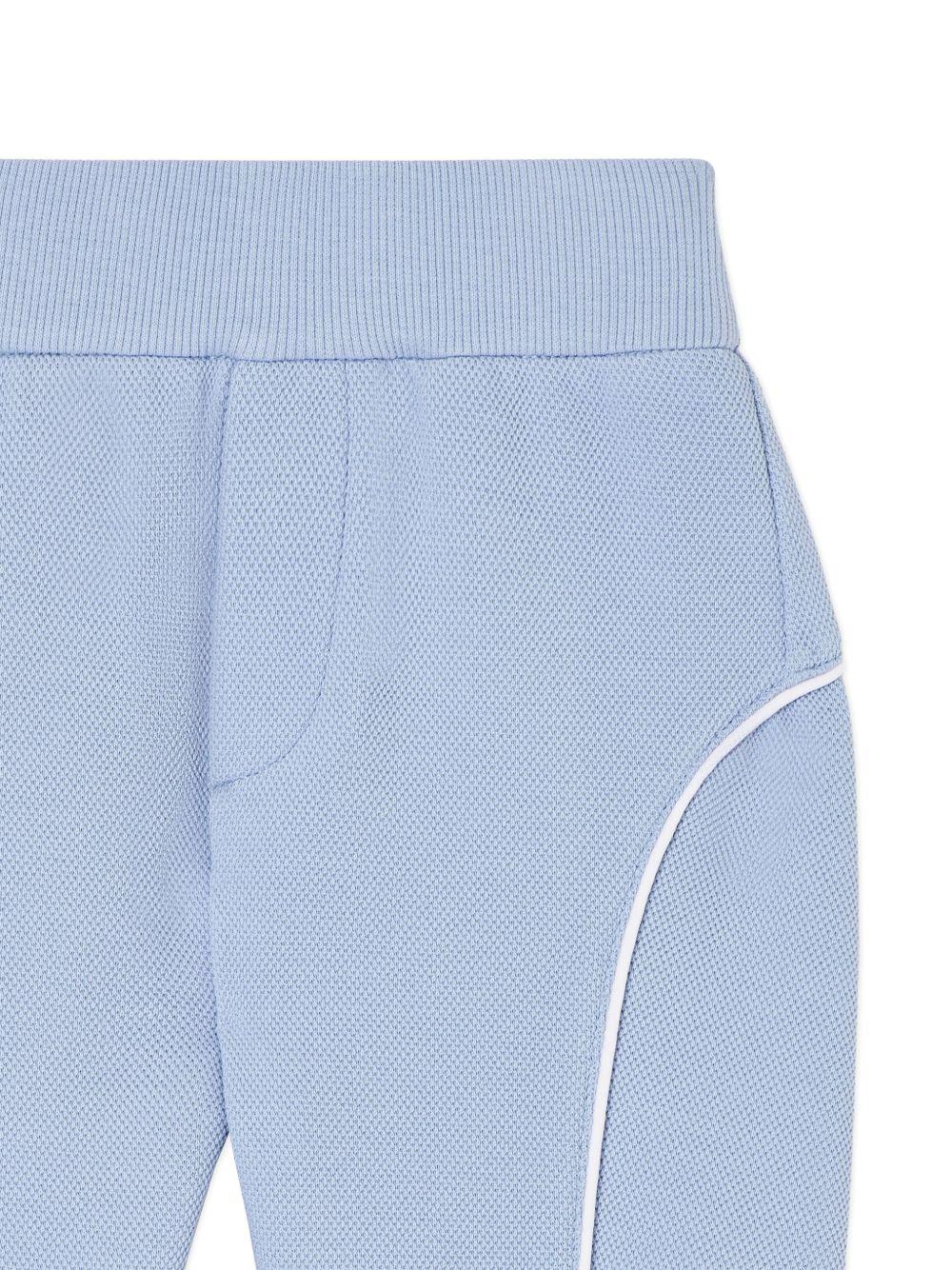 Pantaloni sportivi per neonato Emporio Armani Kids azzurro con logo aquila sul davanti - Image 3