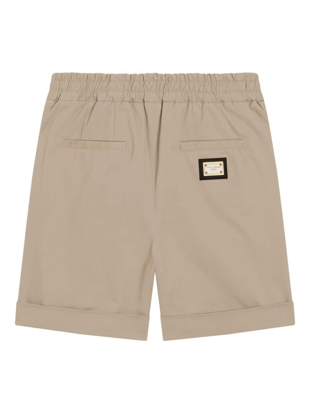 Shorts per bambino Dolce & Gabbana Kids beige con logo posteriore - Image 2